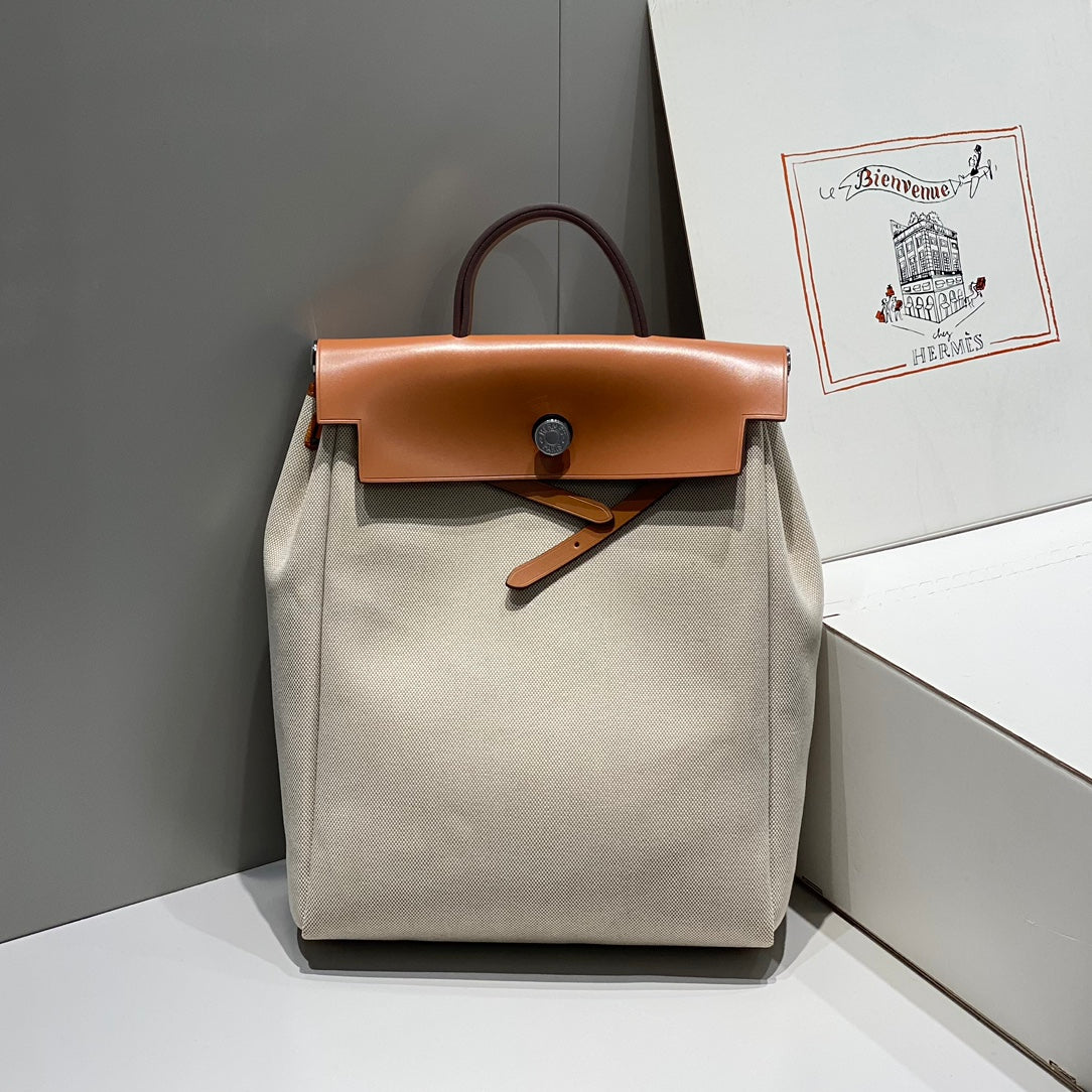 img_43e90bff_20240411_i1712823502_2672_0_jpg.jpg HERBAG A DOS ZIP RETOURNE BACKPACK 29 IN OFF-WHITE CANVAS AND BROWN CALFSKIN - 图片 1